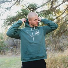 Montana Tree Outline Fleece Hoodie Unisex - Green - The Montana Scene Casual Fleece Hoodie For Outdoor, Casual Outdoor Fleece Hoodie, Outdoor Fleece Sweatshirt With Kangaroo Pocket, Fleece Sweatshirt With Kangaroo Pocket For Outdoor, Fleece Sweatshirt With Kangaroo Pocket For Outdoor Activities, Outdoor Fleece Hoodie With Kangaroo Pocket, Green Hoodie For Outdoor Winter Activities, Long Sleeve Fleece Hoodie For Outdoor Activities, Green Winter Hoodie For Outdoor