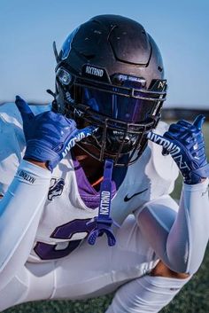 a football player wearing a helmet and gloves