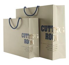 two shopping bags with the words cutting room printed on them