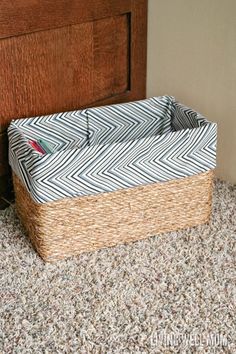 a basket sitting on the floor next to a door