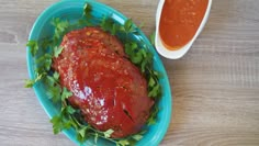 a meatloaf covered in ketchup and garnished with parsley