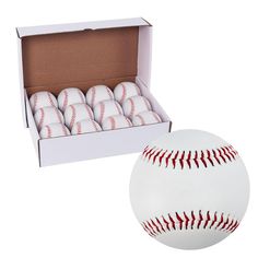 a dozen baseballs in a cardboard box next to a white ball with red stitching