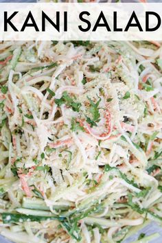 a bowl filled with coleslaw and carrots on top of a table