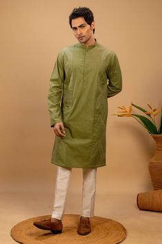 Green kurta with quilted embroidery on left and right side. Paired with a cotton silk churidar. - Aza Fashions Cotton Sherwani With Naqshi For Festivals, Festival Cotton Sherwani With Naqshi, Cotton Naqshi Sets For Festive Occasions, Festive Cotton Sets With Naqshi Detail, Festive Cotton Naqshi Sets, Green Long Sleeve Cotton Churidar, Fitted Cotton Lawn Suit With Dabka Work, Transitional Cotton Salwar Kameez With Zari Work, Pista Green Straight Cotton Kurta