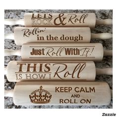 four wooden crochet hooks with different sayings on them, one has a crown and