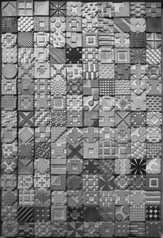 a black and white photo of many different patterns on a piece of paper that has been cut into squares