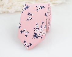 "FREE SHIPPING within USA on orders over $35 and in Canada on orders over $75 Perfect tie for a wedding that has blush pink and navy color pallets. A beautiful and elegant floral pattern tie will go with any suits from light to dak colors. Bow ties for kids, adults and pocket squares are available to complete the looks. ▶ SIZE: - Adult neckties: Approx. 2.75\" wide at the tip, Approx. 58\" length - Pocket Square: Approx. 10\" X 10\" - Adult bow tie (Pretied): Bow is approx. 4.75\" in length and 2.3\" in height. Adjustable strap to fit neck sizes from 11\" - 20\". This size should fit most kids/ adults from 12 years and up. - Kids bow tie (Pretied): Bow is approx. 4\" in length and 2\" in height. Adjustable strap to fit neck sizes from 9\" - 15.5\". This size should fit most kids from 2 yea Pink Standard Tie For Groom, Pink Standard Tie Suit Accessories For Groom, Pink Business Ties For Spring, Dapper Suit And Tie Accessories For Spring Wedding, Pink Fitted Standard Tie, Pink Floral Print Ties For Spring, Pink Standard Tie For Black Tie Events, Elegant Pink Floral Print Tie, Pink Summer Ties For Gifts