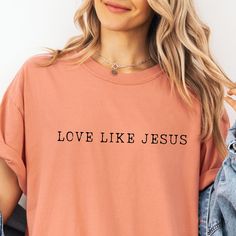 ❤️🙏 Embrace Simplicity and Faith with Our "Love Like Jesus" Minimalist Shirt 🙏❤️ Celebrate the essence of Christian love with our "Love Like Jesus" Minimalist Shirt. Featuring a clean, minimalist design, this shirt is a beautiful reminder to embody Christ's love in our daily lives. It showcases the inspirational phrase "Love Like Jesus" in a simple yet elegant font, reflecting the purity and strength of Christ's love. Ideal for those who appreciate understated, meaningful messages. Perfect For Minimalist Shirts, Christian Love, Group Shirts, Christian Tees, Elegant Font, Jesus Shirts, Religious Gifts, Daily Wear, Comfort Colors