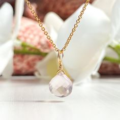 This beautifully simple necklace is lovingly handmade with a stunning AA+ grade Rose Quartz gemstone and a choice of 14k Gold Filled, 14k Rose Gold Filled or Sterling Silver Chain. M A T E R I A L S: * Rose Quartz Heart Briolette  * Grade - AA+ * Origin - Madagascar * 14k Gold Filled, 14k Rose Gold Filled or Sterling Silver Chain S I Z E: *  Pendant - Approximately 8-9mm *  Chain Thickness - Approximately 1.1mm  All of our jewellery is carefully handmade using good quality materials and handpicked gemstones, with the aim to produce quality pieces that you can love & wear for years to come.  R O S E  Q U A R T Z: * Talisman for Taurus, Libra * Heart Chakra Rose Quartz is the stone of universal love. It restores trust and harmony in relationships, encouraging unconditional love. Rose Quartz Elegant Pink Round Charm Necklace, Elegant Pink Round Charm Necklaces, Dainty Pink Gold Jewelry With Birthstone, Dainty Pink Gold Birthstone Jewelry, Delicate Pink Gold Jewelry For Gift, Delicate Rose Gold Birthstone Necklace For Everyday, Feminine Gemstone Jewelry For Gifts, Dainty Pink Gold Gemstone Jewelry, Handmade Rose Gold Briolette Jewelry