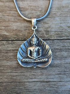 925 sterling silver Scared Fig Buddha Pendant Pendant Dimensions (without the bail) 40 mm x 32 mm All our Silver Jewelry are 925 stamped and 92.5% Pure Sterling silver. We do not use Nickel. The stones used in our Jewelry are all Natural Gemstones 💎. The item listed in the page is the actual item for sale. We have listed the dimensions of the Jewelry in item details. If you should require any other specific dimensions, please message us . Chains used in pendants are not included. 📦Shipping &am Buddha Necklace, Etsy Promotion, Buddha Pendant, Golden Ring, Pendant Silver, Leaf Pendant, Pure Silver, Stone Pendants, Buddhism