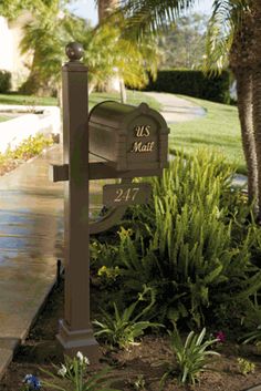 a mailbox in the middle of a garden