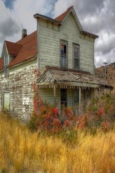 an old run down house in the middle of nowhere