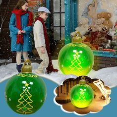 two children are standing in front of christmas decorations and teddy bears on the snow covered ground