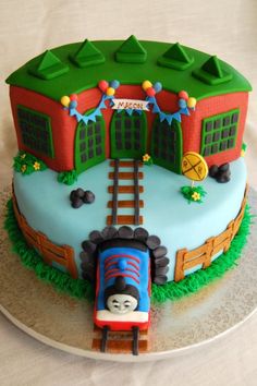 a thomas the train birthday cake on a plate