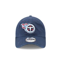 The Tennessee Titans Core Classic 9TWENTY Adjustable Cap features an embroidered Titans logo at the front panels with a woven tab displaying the team logo on a D-Ring closure at the rear. Casual Game Day Hat With Logo Patch, Casual Hats With Logo Patch For Game Day, Casual Cap For Fan Events, Casual Team-colored Baseball Cap With Logo, Casual Team Logo Hat For Fans, Casual Hats With Team Logo For Fans, Casual Fan Merchandise Team Logo Hats, Sporty Hats With Logo Patch For Fans, Casual Fan Merchandise Hat With Logo Patch