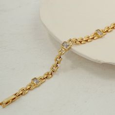 ✦ Adorn your wrist with elegance and sophistication with our 18K gold plated diamond chain bracelet. Crafted in a classic chain style, this bracelet exudes timeless charm and versatility. Featuring sparkling diamonds set in luxurious gold plating, it's the perfect accessory to elevate any outfit with a touch of glamour.----------- DETAILS ------------ Color: Gold - Size (Length): 18.8cm - Materials: Brass, 18K Gold Plated, Cubic Zirconia - SKU: QT2203 Luxury Chain Tennis Bracelet - Gift, Gold Diamond Bracelet With Rectangular Links For Everyday Luxury, Luxury Chain Tennis Bracelet As Gift, Luxury Chain Tennis Bracelet For Gift, Luxury Tennis Chain Bracelet As A Gift, Luxury Everyday Gold Bracelet With Cubic Zirconia, Everyday Luxury Gold Diamond Bracelet With Adjustable Chain, Luxury Everyday Gold Cubic Zirconia Bracelet, Elegant Chain Link Tennis Bracelet Gift