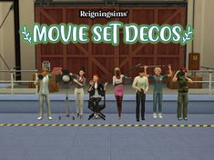 a group of people standing in front of a sign that says movie set decos