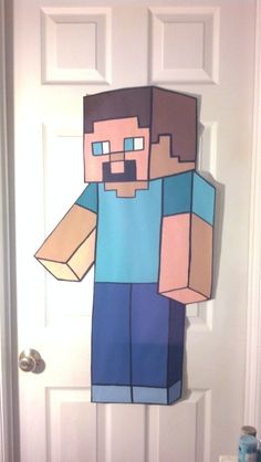 a door decorated with a paper minecraft character