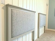 the headboard is up against the wall in the room with carpet on the floor