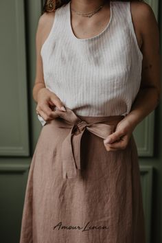 Wrap Linen Skirt: A boho style and minimal aesthetics, trendy ribbon. This skirt, adorned with a charming bow, is your ticket to effortless elegance. It's the go-to choice for summer looks for women, whether you're embracing casual chic or seeking the perfect party look. Perfect for work or a summer Weddings guest outfit idea. IRIS is not just a trendy summer outfit; it's the ideal choice for summer weddings, date nights. Add this piece to your capsule wardrobe! Linen Wrap Skirt, Maternity Nightwear, Linen Outfit, Vegan Store, Viva Magenta, Rosy Brown, How To Dress A Bed, Nightwear Women, Short Kimono