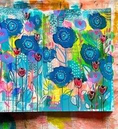 an art journal with blue flowers on it