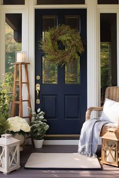 a blue front door with a wreath on it