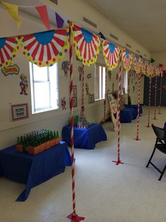 a room filled with tables and chairs covered in decorations