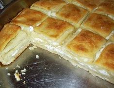 a pan with some food that is cut in half on top of a metal surface