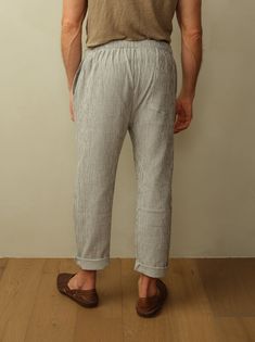 The ultimate vacation pant featuring a drawstring waistband and lightweight double gauze organic cotton. Look your best for long days at the beach, lounging around the hotel, brunch, etc. You get the idea. Fit: Unisex fit. Male model is wearing size M. Female model is wearing size XS. Relaxed fit, tapered leg, drawstring waist. Material: 100% Organic Cotton. Care: Machine wash cold with like color. Tumble dry low. Do not bleach. Cool ironing. Origin: Made in Portugal. Beach Pants With Relaxed Fit And Tapered Leg, Relaxed Fit Tapered Leg Beach Pants, Relaxed Fit Tapered Leg Pants For Beach, Comfortable Summer Lounging Pants, Linen Bottoms With Elastic Waistband For Lounging, Cotton Tapered Leg Bottoms For Vacation, Casual Linen Lounging Bottoms, Comfortable Linen Bottoms For Lounging, Comfortable Linen Lounging Bottoms