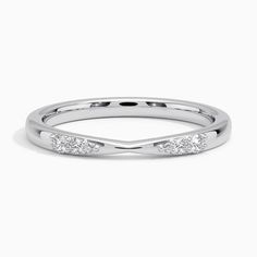 a white gold wedding band with three diamonds