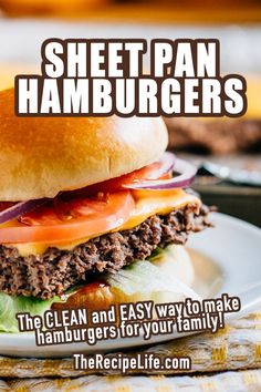 A perfectly cooked cheeseburger on a bun with lettuce, tomato, and read onion. Sheet Pan Hamburgers With Onions, Burger Sheet Pan Dinners, Hamburger Sheet Pan, Sheet Pan Ground Beef Recipes, Cookie Sheet Burgers, Bake Hamburgers In The Oven, Sheet Burgers, Oven Baked Burgers Hamburgers, Oven Hamburgers Hamburger Patties