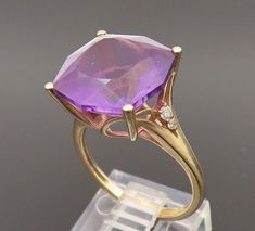 14K GOLD - Vintage Large Amethyst & Real Round Diamonds Dainty Ring Sz 7 - GR655  Jewelry Type:          Ring  Metal Type:             14k Gold   Metal Size:              7 Finger  Stone Type:             Amethyst & Diamond  Condition:               N/A  Jewelry Weight:      4.4 Grams  PLEASE NOTE: THIS ITEM IS PRE-OWNED. ALTHOUGH MOST ITEMS ARE IN VERY GOOD CONDITION, SOME MAY NEED CLEANING AND/OR MINOR REPAIRS. WE MAKE A VERY STRONG EFFORT TO UPLOAD CLEAR PICTURES. PLEASE INSPECT ALL PICTURES AND ASK ALL QUESTIONS YOU MAY HAVE PRIOR TO MAKING A PURCHASE. NOT ALL STONES ARE GENUINE, SOME ARE ENHANCED OR CREATED. Gold Amethyst Diamond Ring In Fine Jewelry Style, 14k Gold Purple Ring With Diamond Accents, Amethyst Ring In Yellow Gold With Diamond Accents, Yellow Gold Amethyst Ring With Diamond Accents, Wedding Amethyst Ring With Diamond Accents In 14k Gold, 14k Gold Amethyst Ring With Diamond Accents For Wedding, Collectible Yellow Gold Jewelry With Accent Stones, Formal Gold Amethyst Ring With Diamond Accents, Gold Amethyst Jewelry With Accent Stones