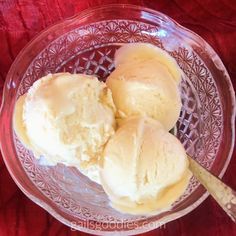 three scoops of ice cream in a glass bowl