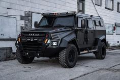 an armored vehicle parked in front of a building