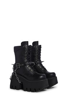 only the strong survive. These combat boots have a vegan leather construction, front lace up closure, removable o-ring belts, spiked detailing, removable chainlink, and cushioned upper. Streetwear Lace-up Combat Boots With Rivets, Punk Style Chain Boots For Streetwear, Edgy Chain Boots For Streetwear, Chain Detail Boots With Round Toe For Streetwear, Chain Detail Round Toe Boots For Streetwear, Chain Detailed Round Toe Boots For Streetwear, Chain-decorated Round Toe Boots For Streetwear, Punk Style Lace-up Boots With Buckle Closure, Edgy Combat Boots With Buckle For Streetwear