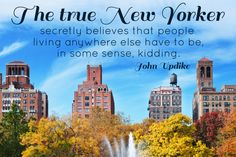 a fountain in the middle of a park surrounded by tall buildings and trees with a quote from john updike