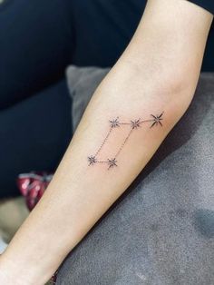 a person with a star tattoo on their arm