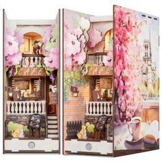 an open book with some pictures on the front and back cover that is decorated like a doll house