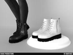 a pair of white boots sitting next to each other on top of a white platform