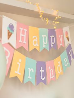 a happy birthday banner with ice cream cones on it