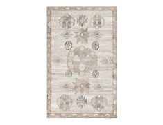 a white rug with an intricate design on the front and back side, in neutral tones