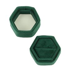 two green velvet hexagonal mirrors on white background