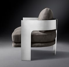 a modern chair with a curved backrest and cushion on the seat is shown in black and white