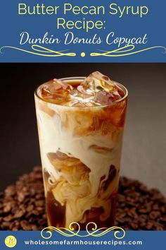 an iced drink in a tall glass with ice and coffee beans on the side that says, butter pecan syrup recipe dunkin donuts copycat