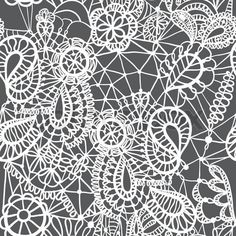 an abstract white lace pattern on a black background