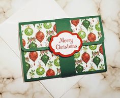 a christmas card on top of an envelope