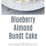 blueberry almond bundt cake on a white plate with the words blueberry almond bundt cake