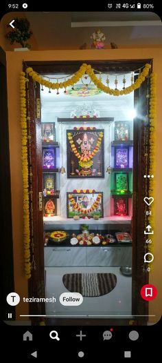 an open door with decorations on it and lights in the room behind it that is decorated for diwaling