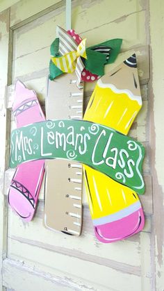 a wooden sign that says mrs lemonade class on the side of a door with a ruler