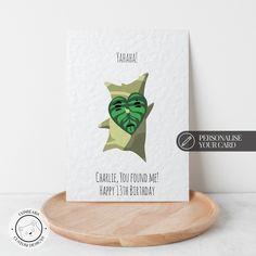 a greeting card with an image of a green creature on it's face and the words happy birthday